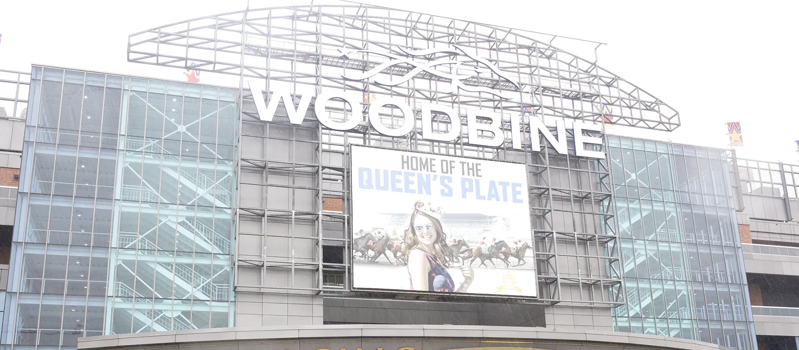 The Woodbine Racetrack grandstand facade with the Woodbine wordmark and steel roof trusswork