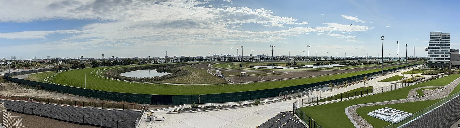 Panoramic view of the Woodbine Racetrack oval and grandstand grounds in Toronto